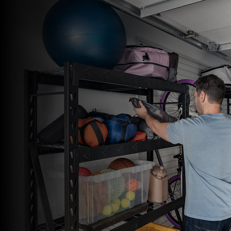 A person grabbing an item off a Gladiator® rack shelf