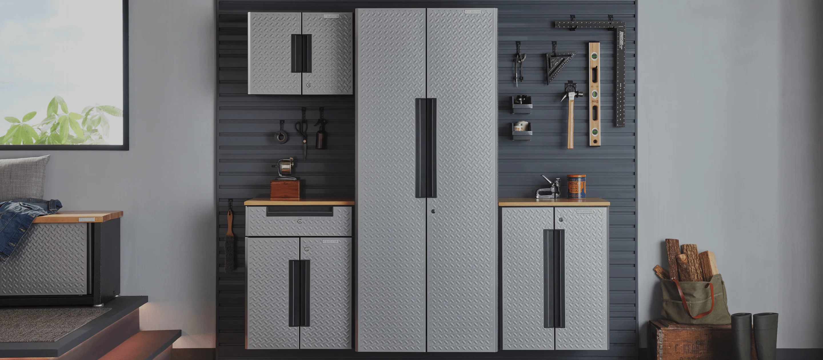 Gladiator Cabinet System V mounted to slatwall with tools hanging from walls.