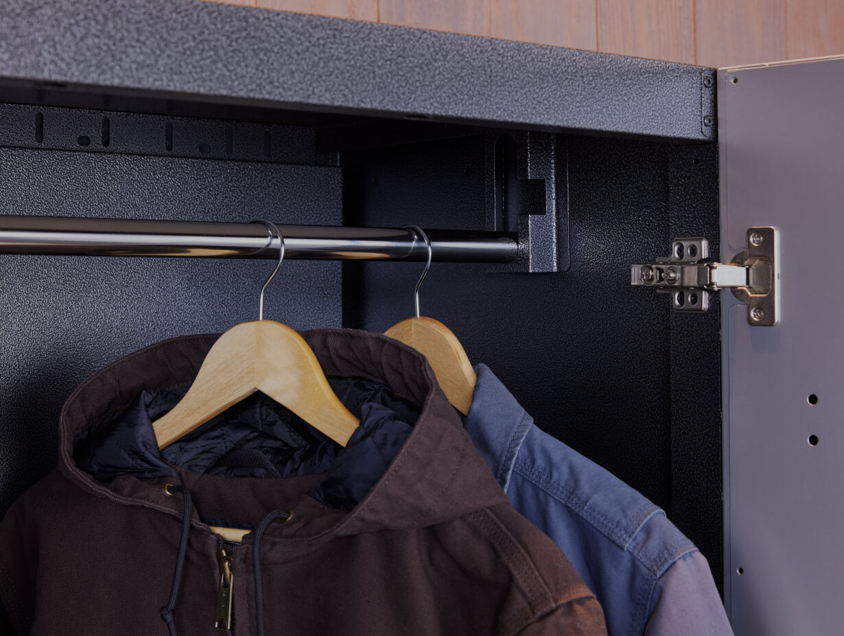 A closeup of clothes hanging on a clothing rack.