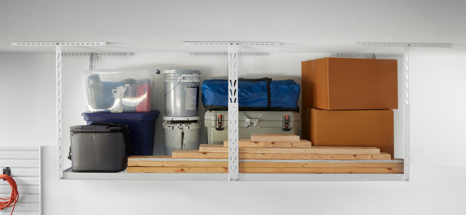 A white 4x8 Overhead Storage Rack hold large and bulky items.