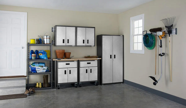 Garage featuring gladiator upper, base and full sized cabinets.